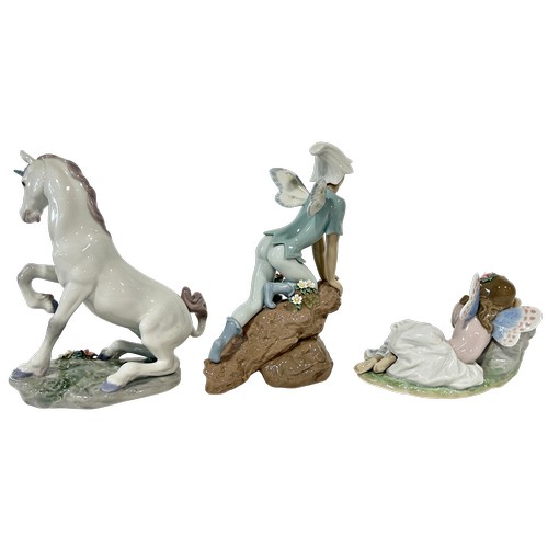 45 - A collection of three Lladro figures group, number 7694 - Princess of the Fairies, 7690 - Prince of ... 