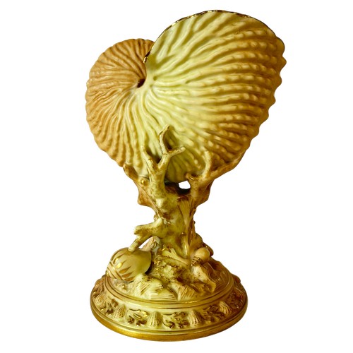 51 - A Worcester porcelain nautilus shell with coral encrusted base, a further Worcester jar and cover wi... 