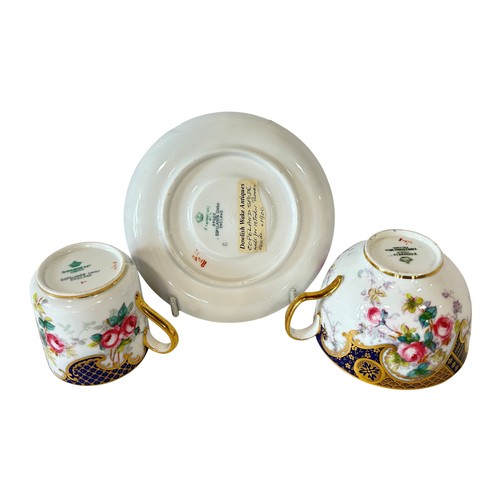 52 - A Copeland trio with hand painted floral detail within blue and gilt borders, retailed by Thomas Goo... 