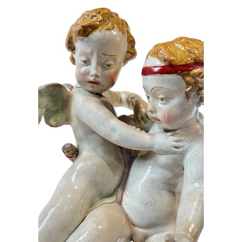 53 - A 19th century pottery group showing Eros tussling with Anteros, attributed to Enoch Wood, 38cm high