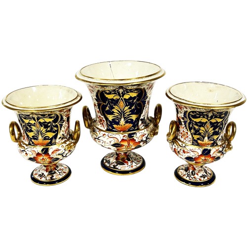 10 - Three 19th century Derby urn shaped vases, richly decorated with floral sprays in red, blue and gilt... 