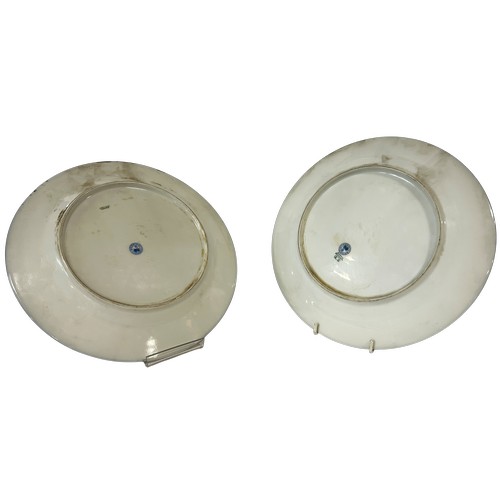 23 - Pair of Limoges decorative plates showing Golden and Common Pheasants, set within blue and gilt bord... 