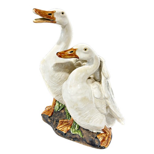 18 - A large Beswick Fireside Beagle, no 2300, together with a large stoneware group of a goose and gande... 