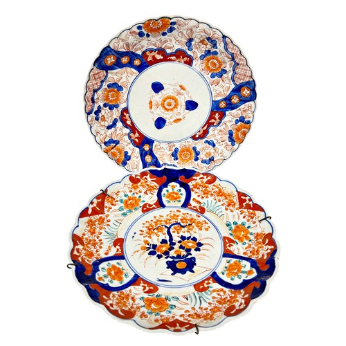 50 - Two Japanese imari porcelain wall chargers with scalloped edges, 31cm diameter approx. (2)
