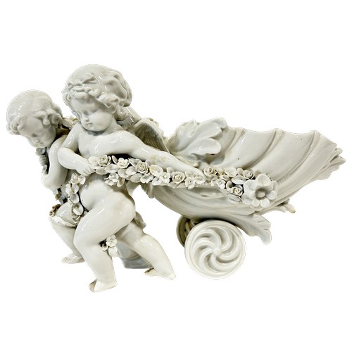 41 - A Capodimonte group of a young girl and cupid, together with a Sitzendorf figure group - romantic fl... 