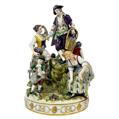 42 - Two continental porcelain groups one of circular form depicting gardening, the other a musical group... 