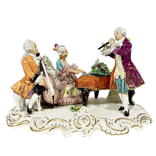 42 - Two continental porcelain groups one of circular form depicting gardening, the other a musical group... 