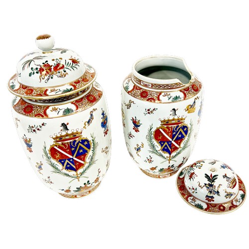 53 - A pair of Chinese armorial vases with a central crest surrounded by auspicious symbols, height: 40 c... 