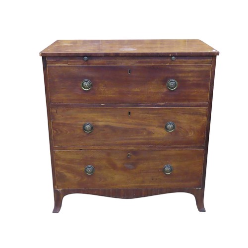An early 19th century mahogany chest, of three long drawers, with ...
