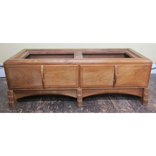 1523 - A fine quality Cotswold school fitted wardrobe in pale English walnut, the panelled frame enclosed b... 