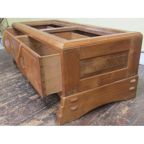 1523 - A fine quality Cotswold school fitted wardrobe in pale English walnut, the panelled frame enclosed b... 