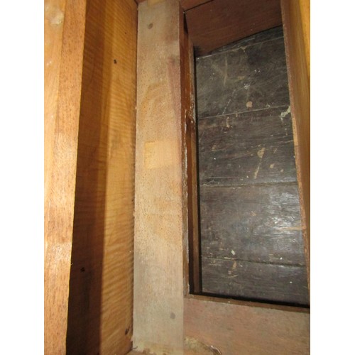 1523 - A fine quality Cotswold school fitted wardrobe in pale English walnut, the panelled frame enclosed b... 