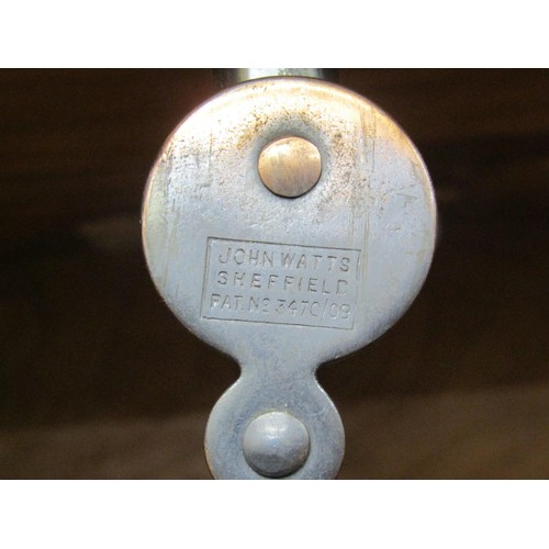 1523 - A fine quality Cotswold school fitted wardrobe in pale English walnut, the panelled frame enclosed b... 