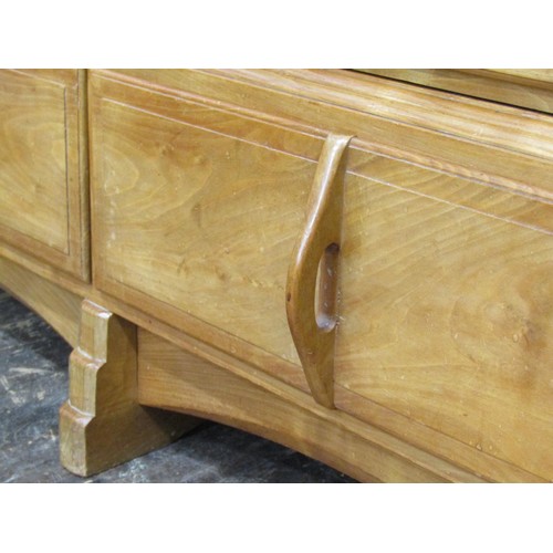 1523 - A fine quality Cotswold school fitted wardrobe in pale English walnut, the panelled frame enclosed b... 