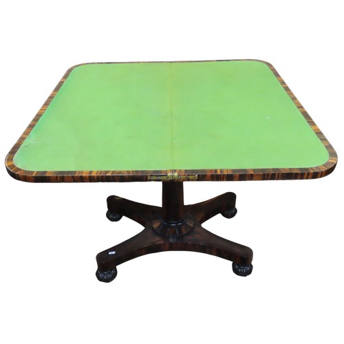 1524 - A 19th century fold over top card table, veneered in coromandel, raised on simple turned pillar with... 