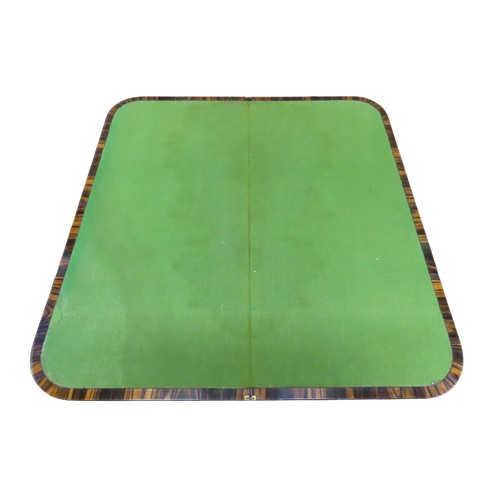 1524 - A 19th century fold over top card table, veneered in coromandel, raised on simple turned pillar with... 