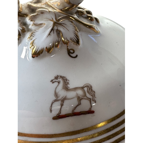 9 - A 19th century part dinner service, in white with gilded borders and armorial crest, comprising: gra... 