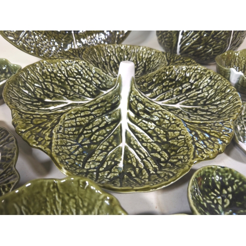 39 - A large collection of Secia of Portugal green leaf pattern tableware, comprising: graduated plates, ... 