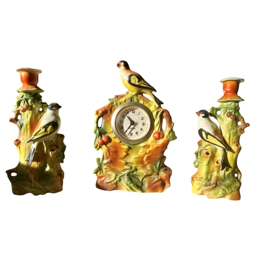17 - A large collection of Edwardian period mantel clocks, all with ceramic cases and transfer printed de... 