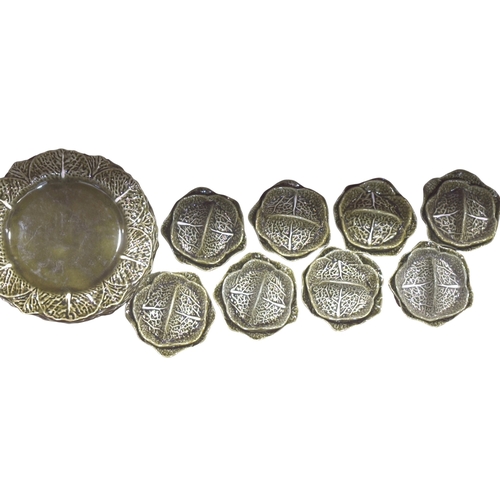 39 - A large collection of Secia of Portugal green leaf pattern tableware, comprising: graduated plates, ... 