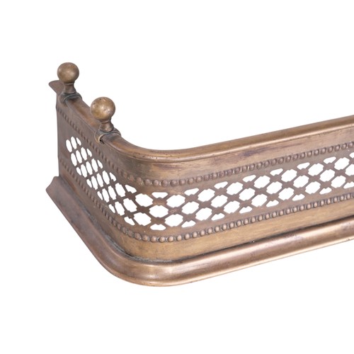 711 - A small early 20th century brass fire fender, 59cm wide