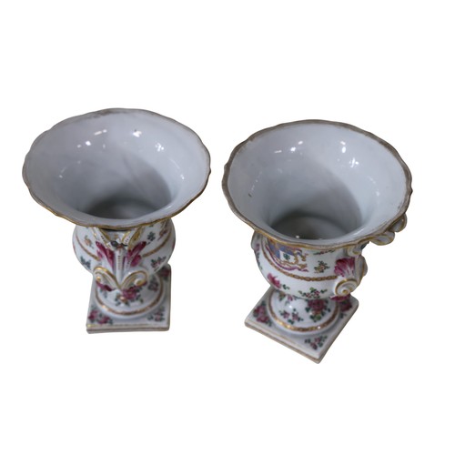 6 - A pair of French Samson of Paris armorial urns / vases, each campana shaped bowl on a pedestal foot ... 