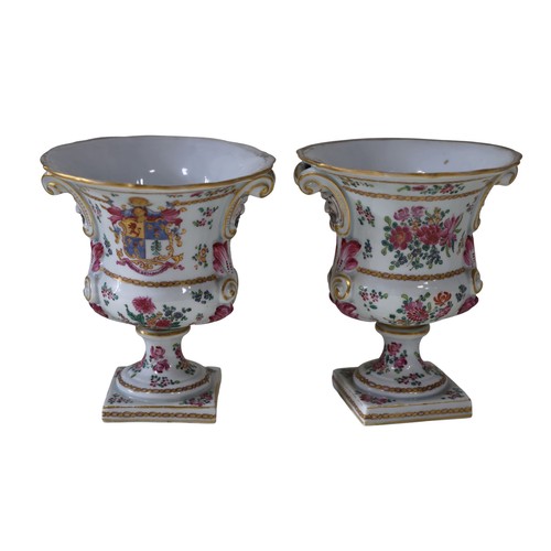 6 - A pair of French Samson of Paris armorial urns / vases, each campana shaped bowl on a pedestal foot ... 
