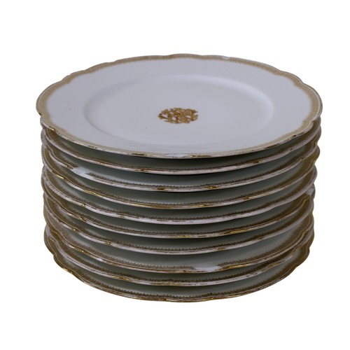 9 - An extensive collection of 19th century French tableware, with shaped and gilded borders, with monog... 