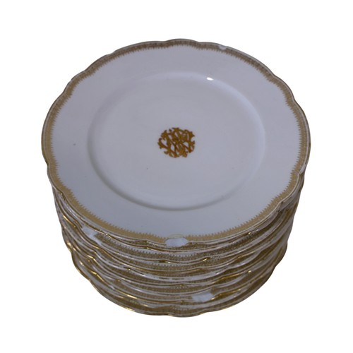 9 - An extensive collection of 19th century French tableware, with shaped and gilded borders, with monog... 