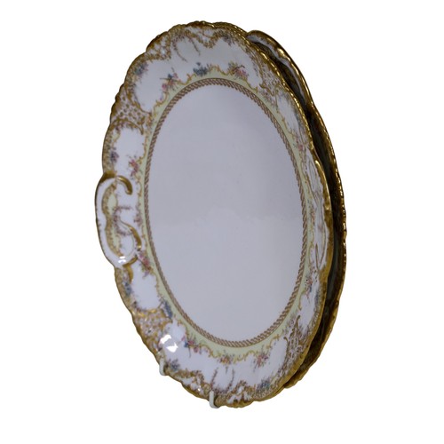 10 - Ten 19th century French porcelain dinner plates, with floral borders, together with two matching dis... 