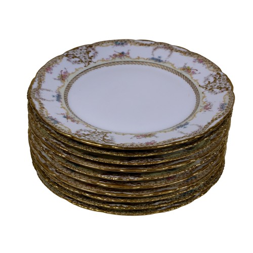 10 - Ten 19th century French porcelain dinner plates, with floral borders, together with two matching dis... 