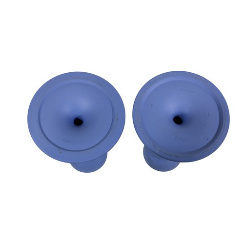 13 - A pair of blue Wedgwood Jasperware candlesticks, together with a campana shaped green Wedgwood vase,... 