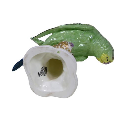 19 - A Royal Worcester figure of a Budgerigar, upon a stump, 2664