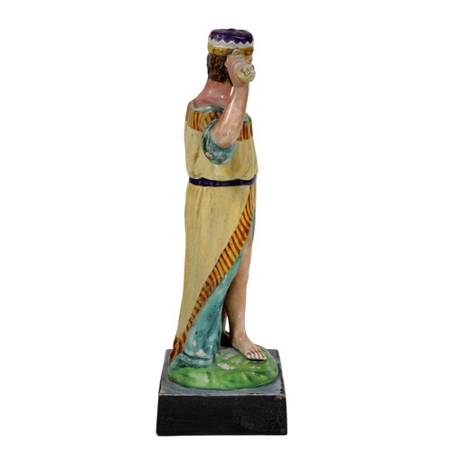 20 - A 19th century Staffordshire pearlware figure, modelled as Jupiter with crown, attendant eagle at hi... 