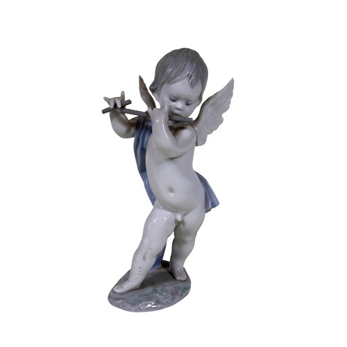 22 - A group of four Lladro figures, to include 