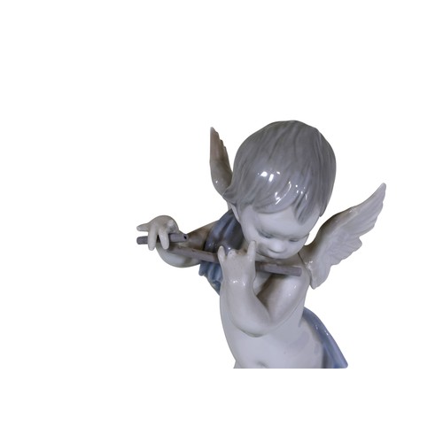 22 - A group of four Lladro figures, to include 