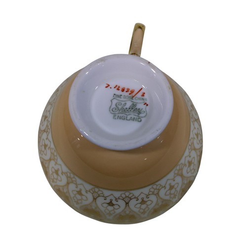 32 - Crown Staffordshire cream and gilt tea ware, further similar pieces marked Shelley, together a Minto... 