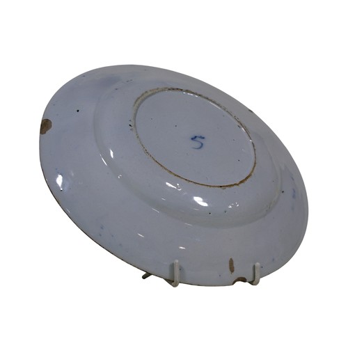 36 - An 18th century tin glazed dish with floral detail, 22cm diameter