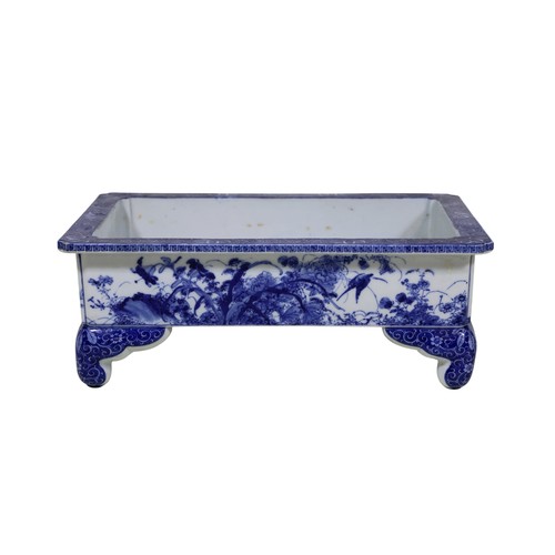 53 - An early 20th century Japanese blue and white rectangular jardinière, with floral banded detail, app... 