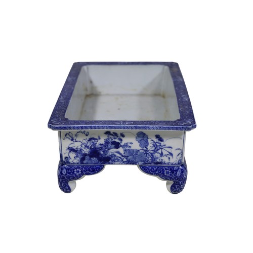 53 - An early 20th century Japanese blue and white rectangular jardinière, with floral banded detail, app... 
