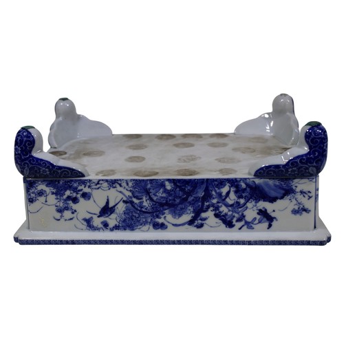 53 - An early 20th century Japanese blue and white rectangular jardinière, with floral banded detail, app... 