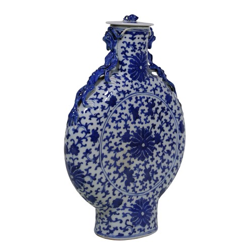54 - A 19th century Chinese moon flask, with applied dragon mounts and floral detail, with associated cov... 
