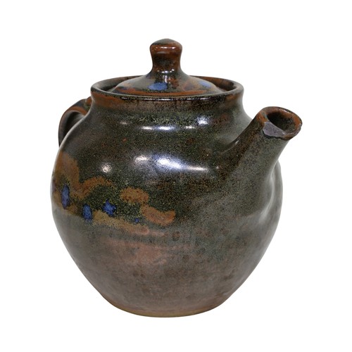 26 - A Winchcombe pottery teapot, ten stoneware glazed graduated plates, some marked for David Frith, tog... 