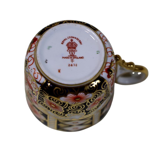 28 - A collection of Royal Crown Derby Imari pattern coffee cans and saucers, two shapes