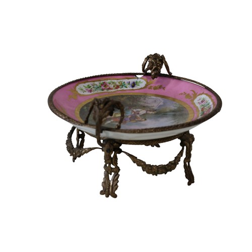 45 - A late 19th century French porcelain centre dish, with hand-painted floral bouquets, to the centre a... 