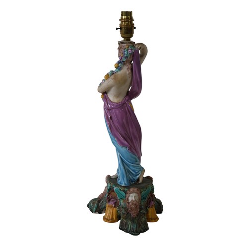 46 - A pair of 19th century Majolica comport stands, male and female characters each holding a cornucopia... 