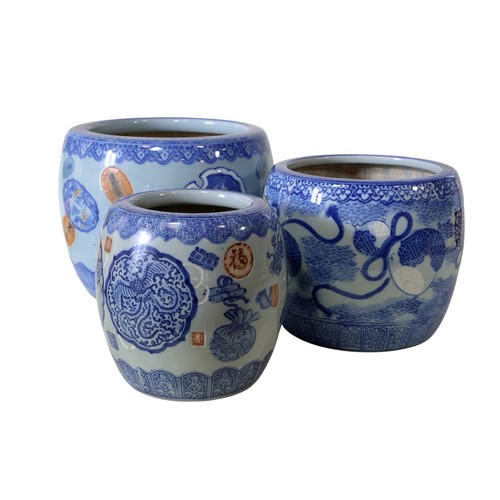 48 - Seven Chinese jardinières, in blue and white, celadon and other glazes, 29cm high maximum (7)