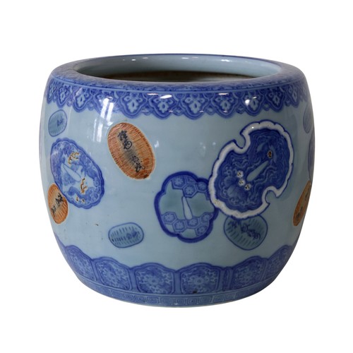 48 - Seven Chinese jardinières, in blue and white, celadon and other glazes, 29cm high maximum (7)