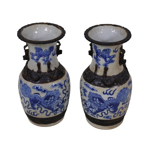 49 - A pair of Chinese blue and white baluster shaped vases, with temple lion, cloud, fire and other deta... 