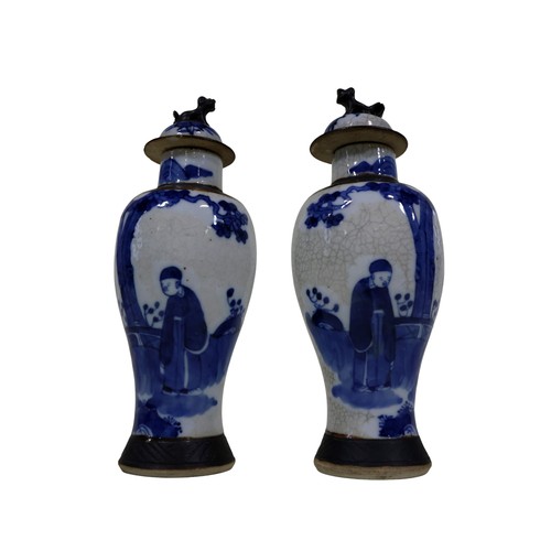 50 - A pair of Chinese crackle glaze inverted baluster shaped vases and covers, character and landscape d... 